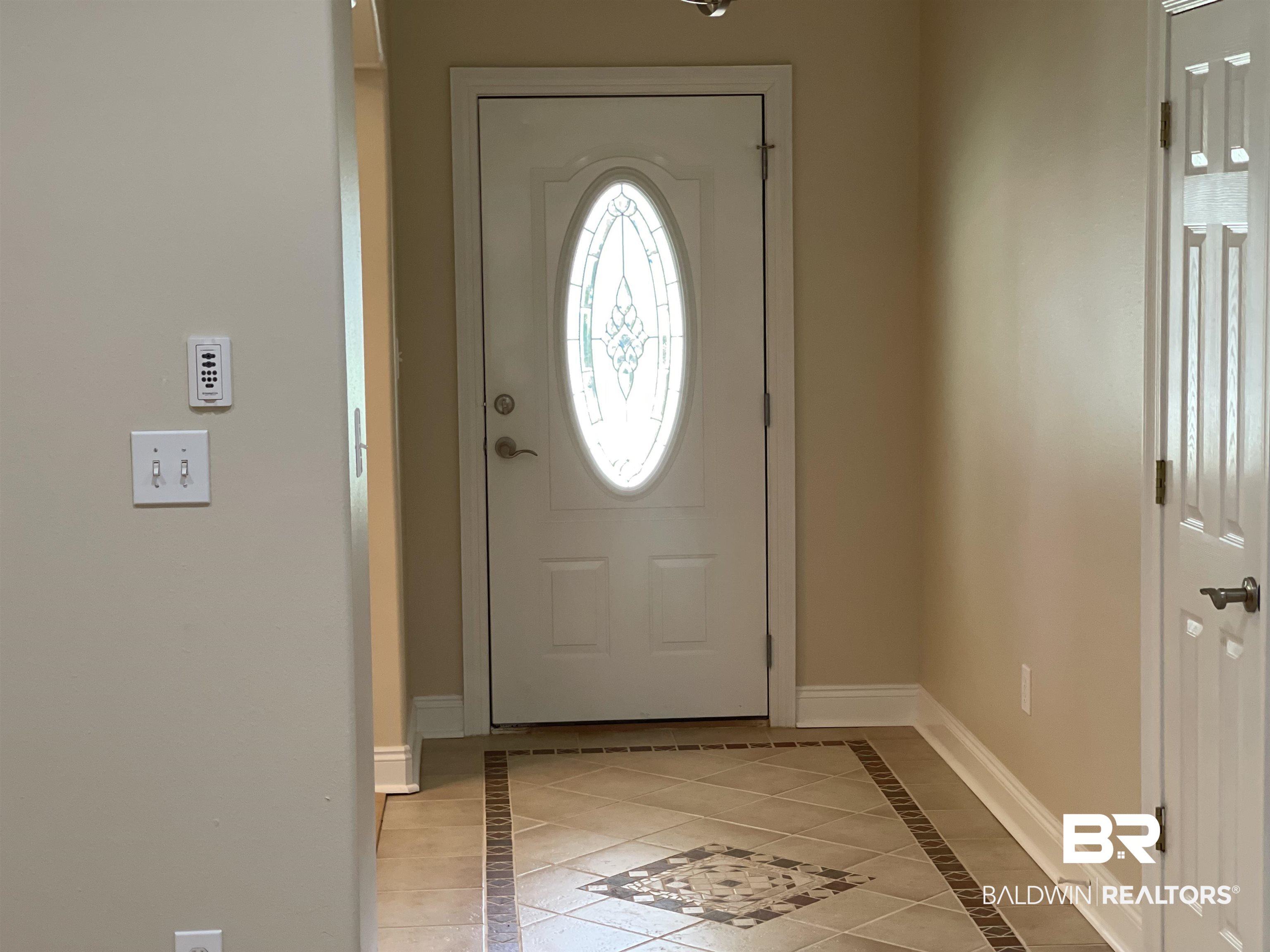 210 Savannah Circle Foley, AL 36535 - Photo 6 of 18 Foyer entrance featuring tile floors