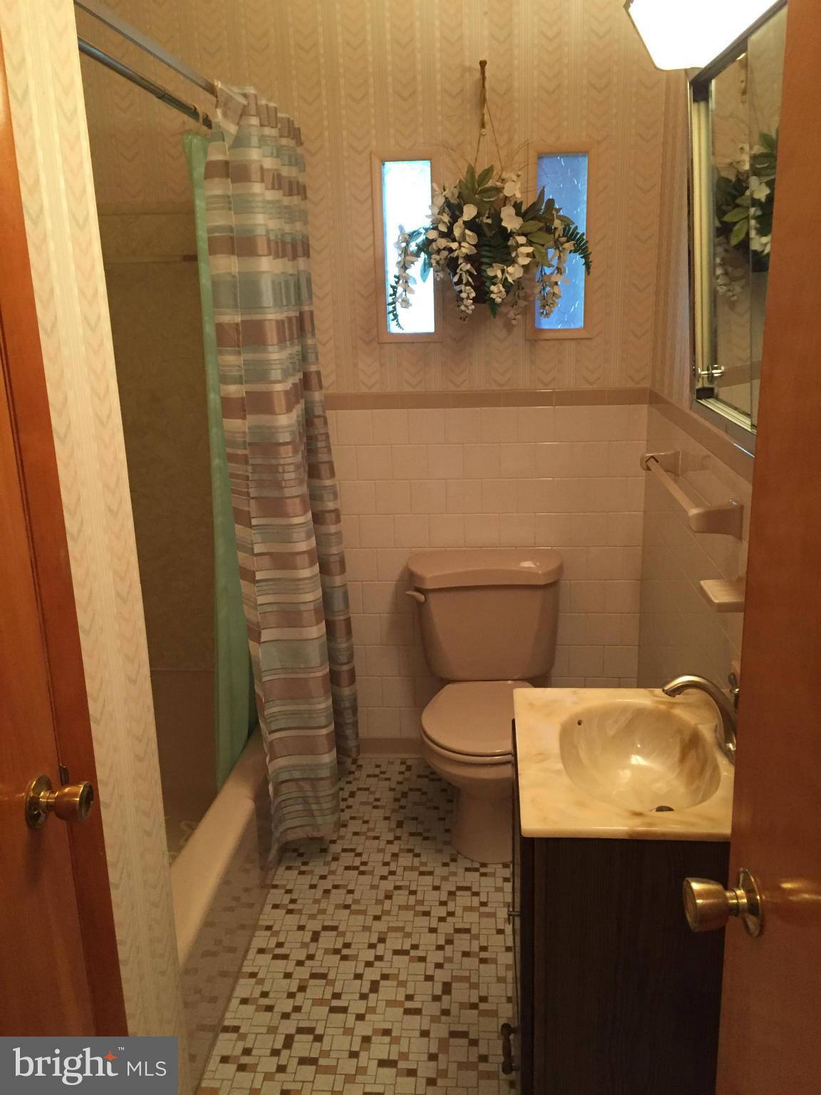 2528 Greene Road Baldwin, MD 21013 - Photo 16 of 30 a bathroom with a toilet and a shower