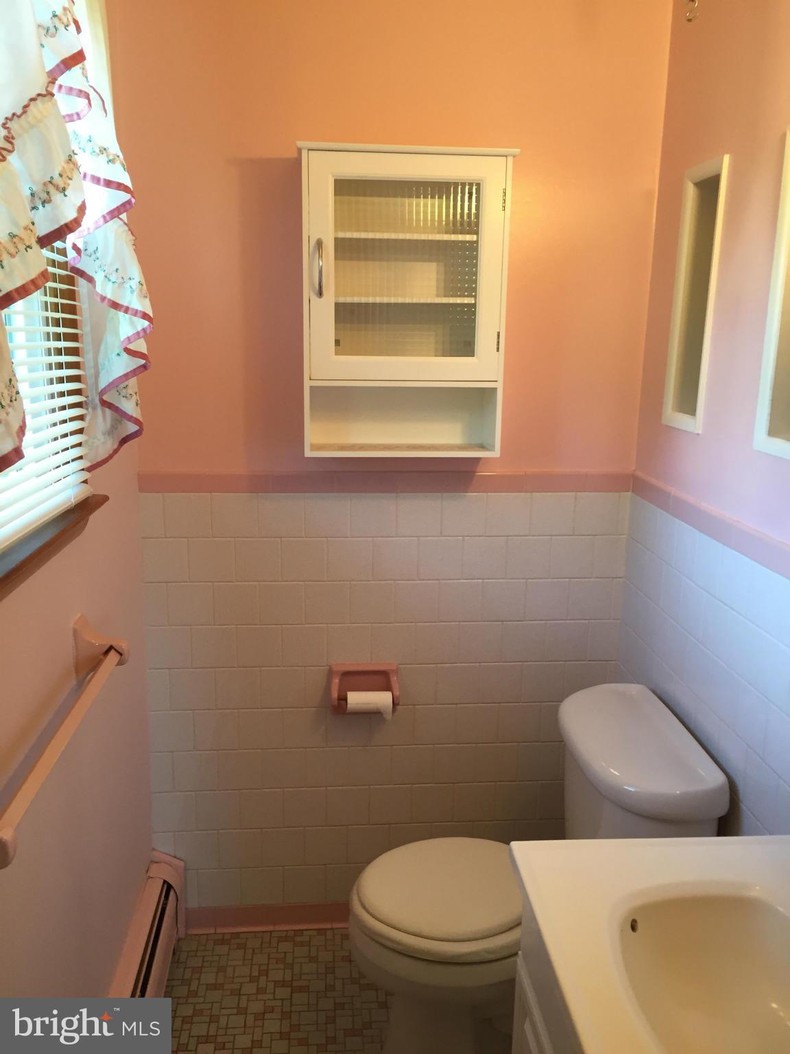 2528 Greene Road Baldwin, MD 21013 - Photo 19 of 30 a bathroom with a toilet sink and mirror