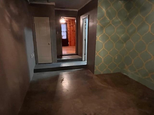 136 Northwest Ave F Hamlin, TX 79520 - Photo 10 of 27 a view of a hallway with wooden floor and a bathroom