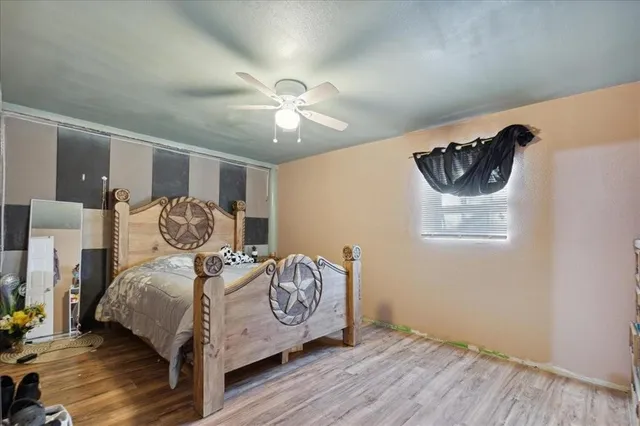 a view of empty room with window and bedroom view