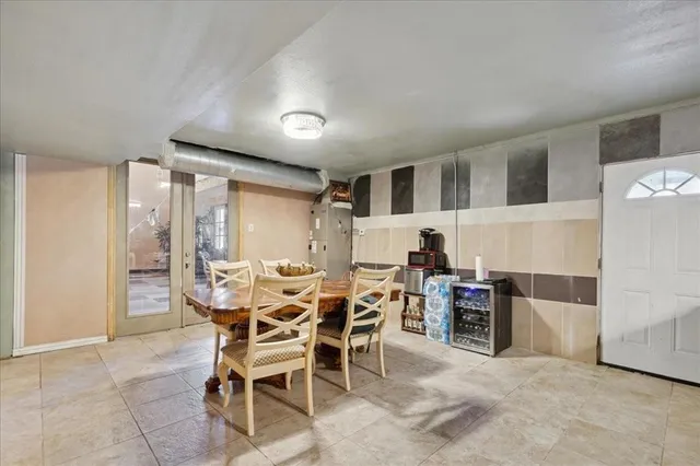 a kitchen with a refrigerator a stove a sink and cabinets