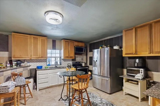 a bed room with a bed and a flat screen tv