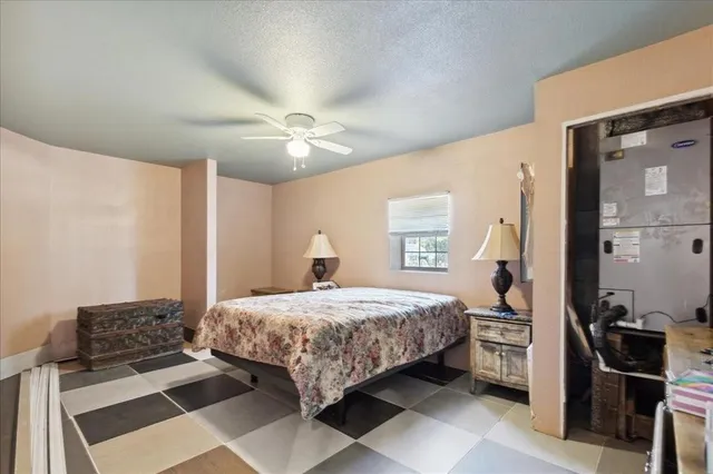 a bathroom with a sink a toilet a mirror and shower curtain