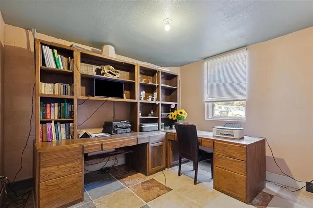 a white toilet sitting next to a bathroom sink