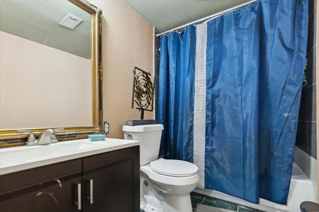 a view of kitchen and hallway with wooden floor