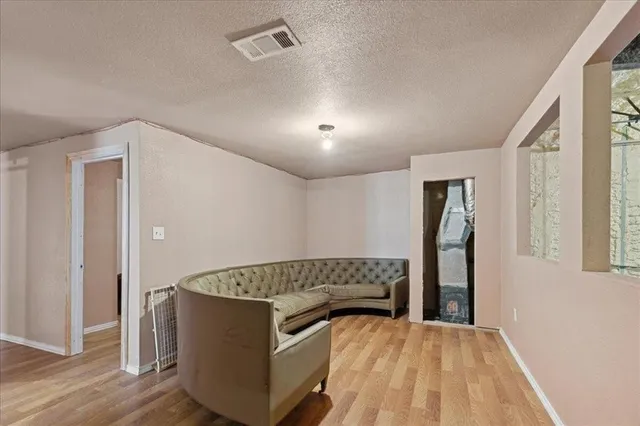 a bedroom with a bed and a table