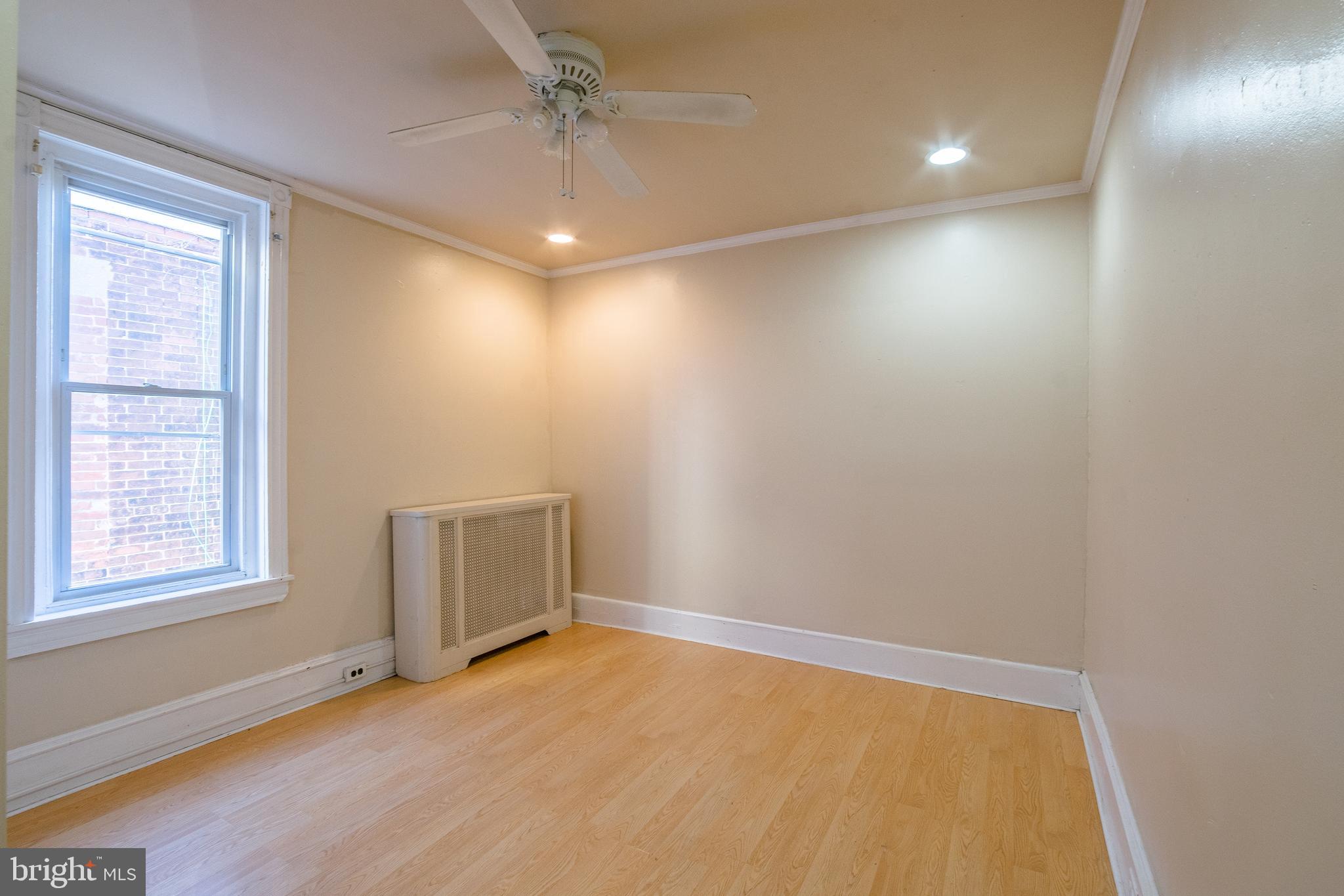 1720 Moore Street, Unit 2 Philadelphia, PA 19145 - Photo 11 of 15 a view of an empty room with a window