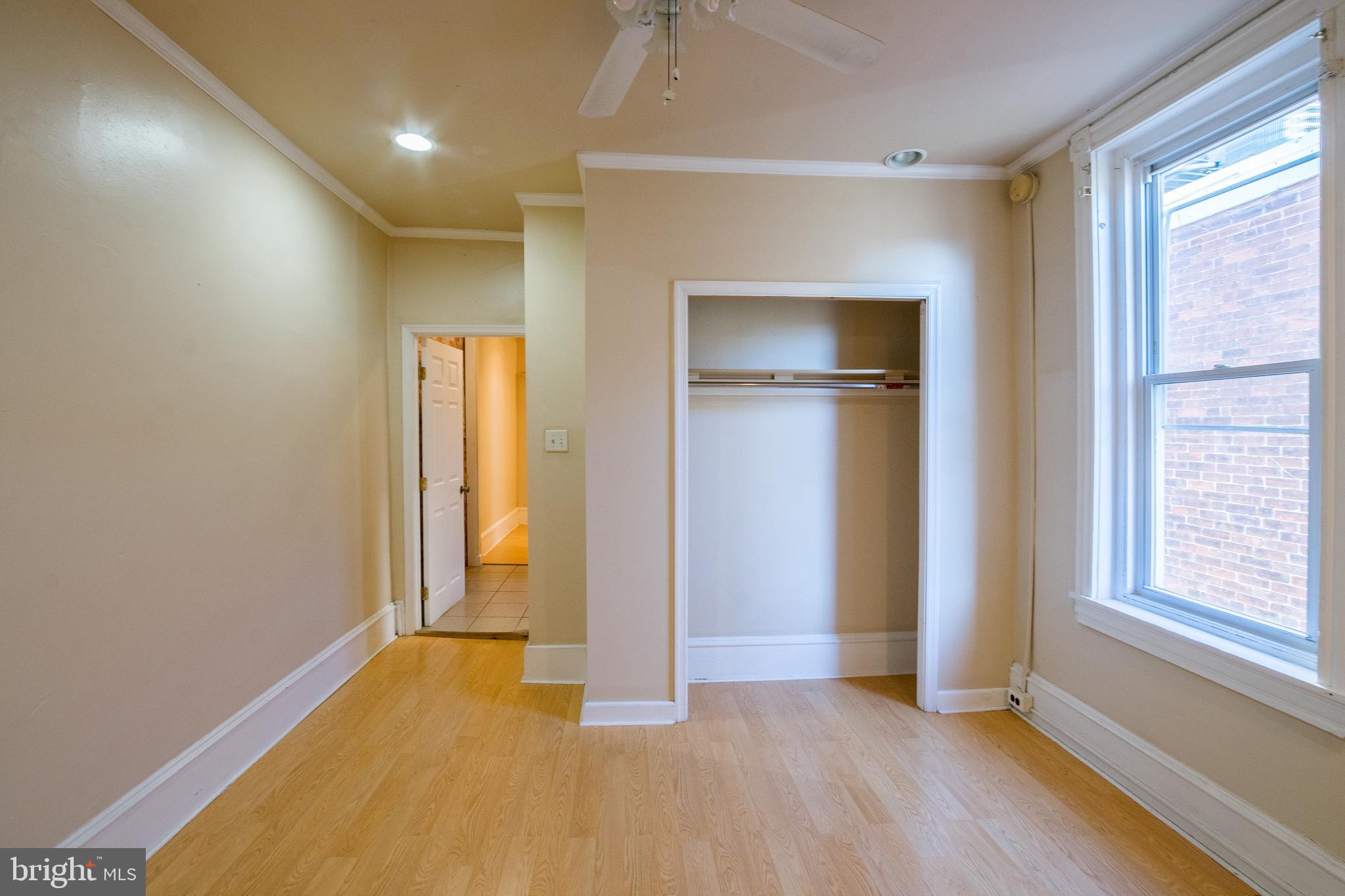 1720 Moore Street, Unit 2 Philadelphia, PA 19145 - Photo 12 of 15 an empty room with closet and windows