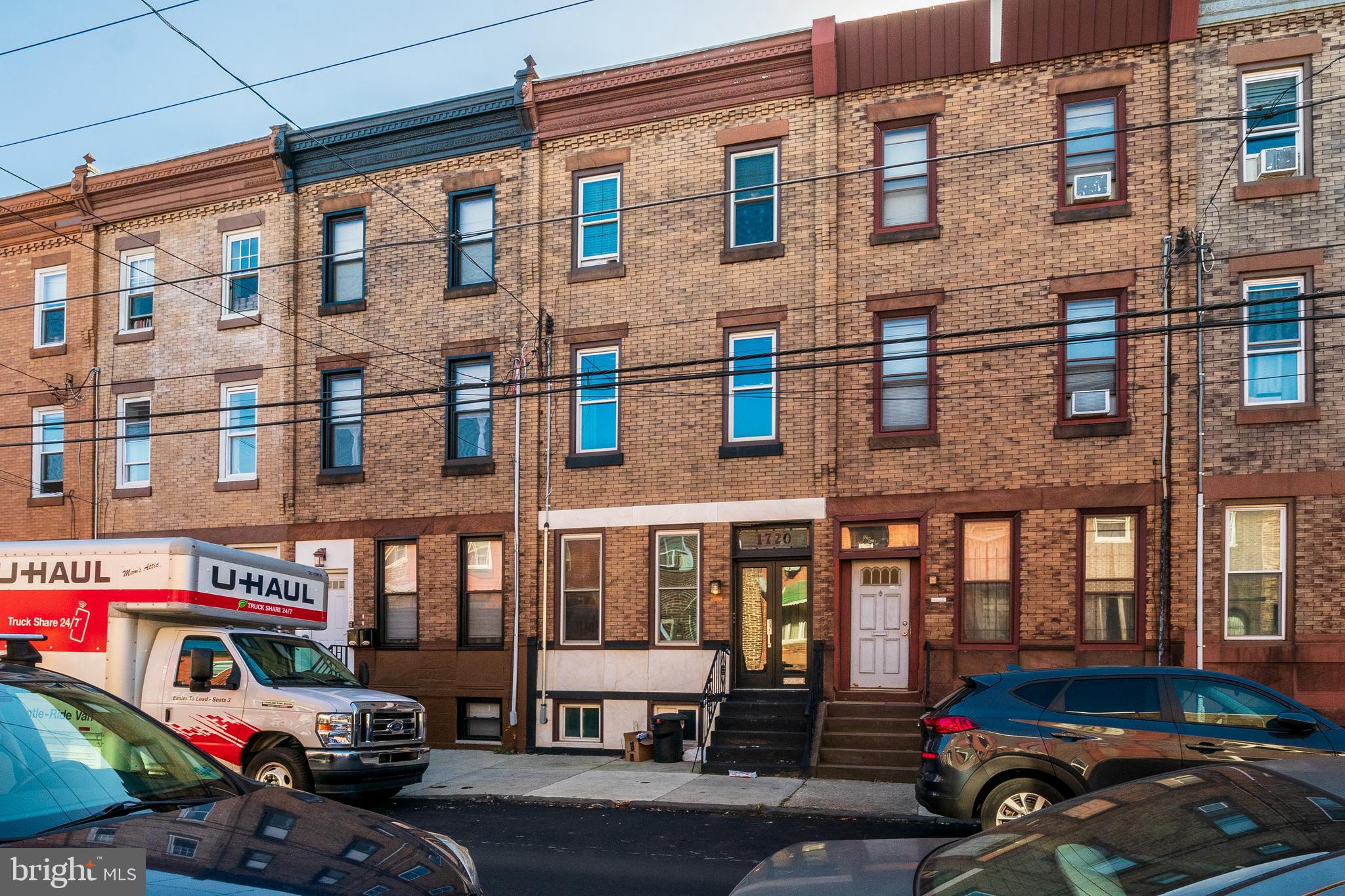 1720 Moore Street, Unit 2 Philadelphia, PA 19145 - Photo 15 of 15 a car parked in front of a brick building