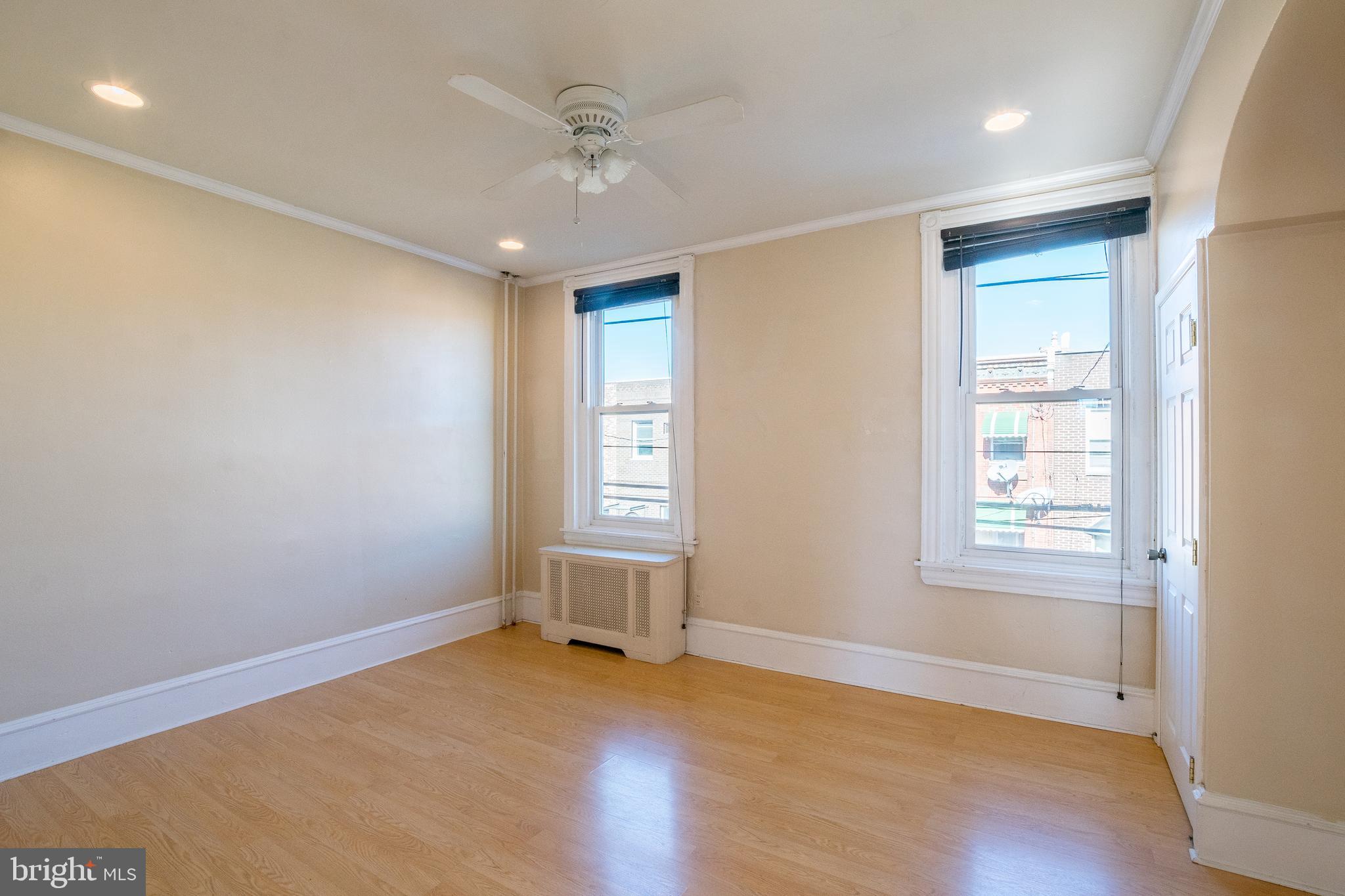 1720 Moore Street, Unit 2 Philadelphia, PA 19145 - Photo 8 of 15 a view of an empty room with a window