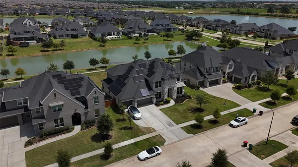 a view of a swimming pool with a table and chairs