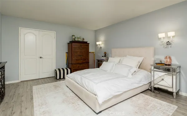 a bedroom with a bed and a couch