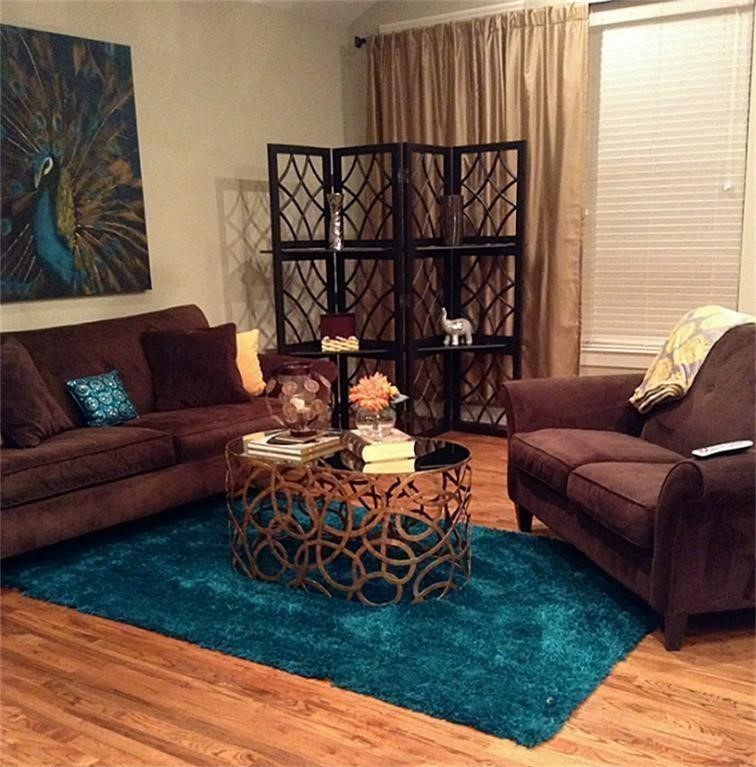 2423 Roufa Road Houston, TX 77003 - Photo 22 of 22 A large family room that includes beautiful windows, a spectacular kitchen, and a combination bar and dining area.