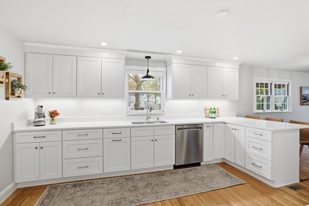 5 Sheffield Road Stoneham, MA 02180 - Photo 15 of 37 a kitchen with sink cabinets and window