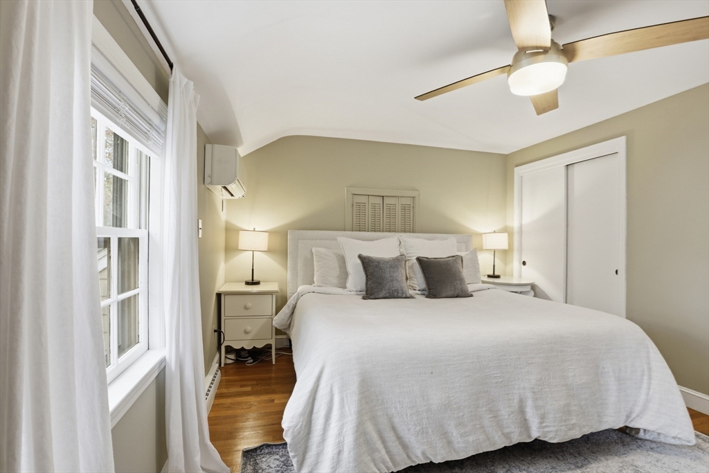 5 Sheffield Road Stoneham, MA 02180 - Photo 22 of 37 a bedroom with a bed and a chandelier