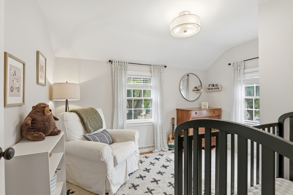 5 Sheffield Road Stoneham, MA 02180 - Photo 23 of 37 a bedroom with furniture and a window