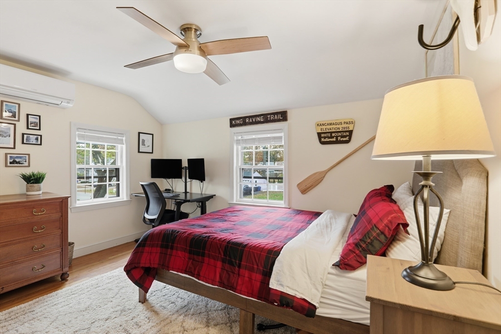 5 Sheffield Road Stoneham, MA 02180 - Photo 25 of 37 a bedroom with a bed and a flat screen tv