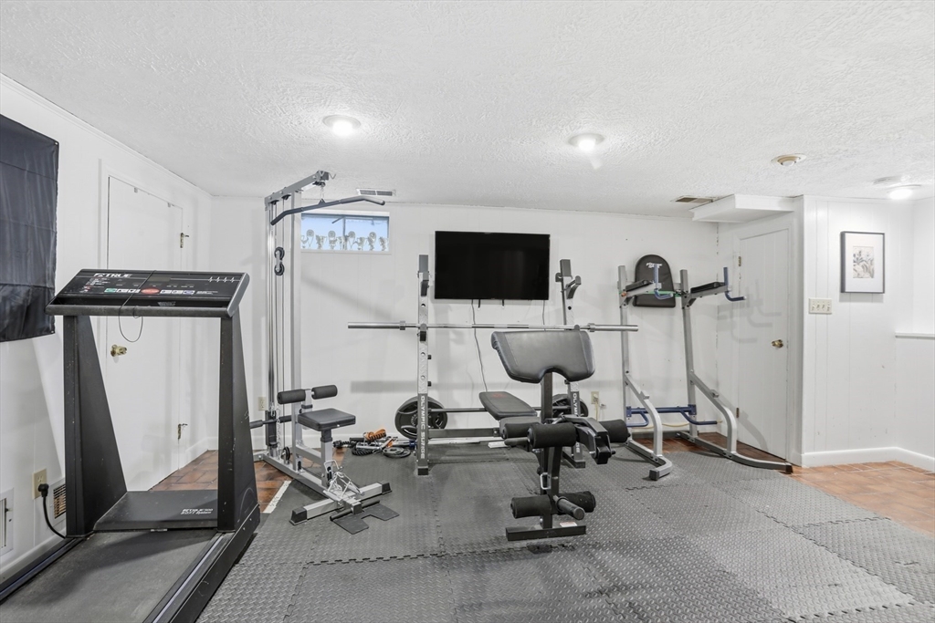 5 Sheffield Road Stoneham, MA 02180 - Photo 29 of 37 a view of a room with gym equipment