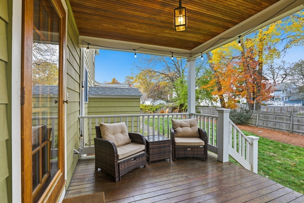 5 Sheffield Road Stoneham, MA 02180 - Photo 4 of 37 a balcony with furniture and wooden floor