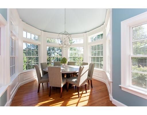 97 Meadowbrook Road Weston, MA 02493 - Photo 13 of 30 a view of a dining room with furniture wooden floor and chandelier