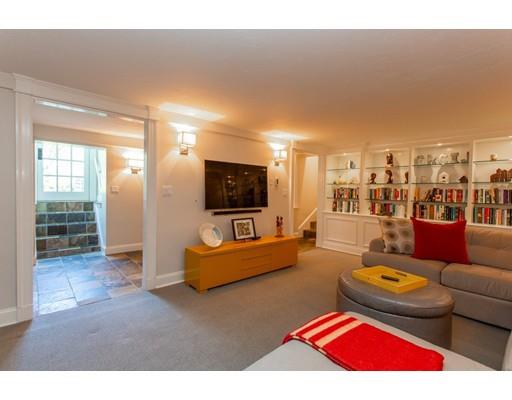 97 Meadowbrook Road Weston, MA 02493 - Photo 27 of 30 a living room with furniture and a flat screen tv