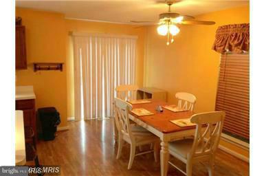 4444 Silver Teal Road Baltimore, MD 21236 - Photo 3 of 7 a view of a dining room with furniture and wooden floor