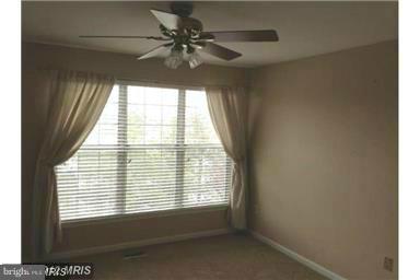 4444 Silver Teal Road Baltimore, MD 21236 - Photo 5 of 7 a view of an empty room and window