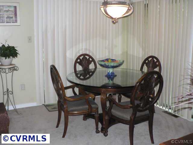 3003 Long Oaks Road Midlothian, VA 23112 - Photo 3 of 7 a view of a table and chairs in a patio