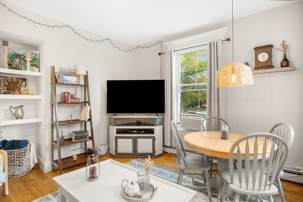 149 High Street, Unit 4 Danvers, MA 01923 - Photo 12 of 33 a living room with furniture and a flat screen tv