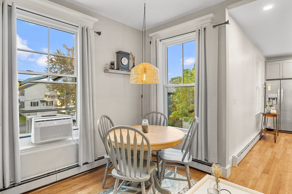 149 High Street, Unit 4 Danvers, MA 01923 - Photo 13 of 33 a view of a dining room with furniture window and wooden floor