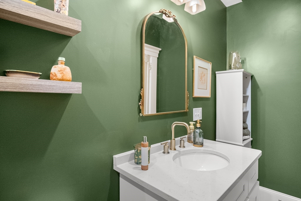 149 High Street, Unit 4 Danvers, MA 01923 - Photo 18 of 33 a bathroom with a sink and a mirror