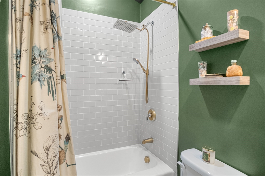 149 High Street, Unit 4 Danvers, MA 01923 - Photo 19 of 33 a bathroom with a sink toilet and shower