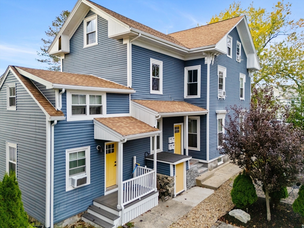 149 High Street, Unit 4 Danvers, MA 01923 - Photo 2 of 33 a front view of a house with a porch