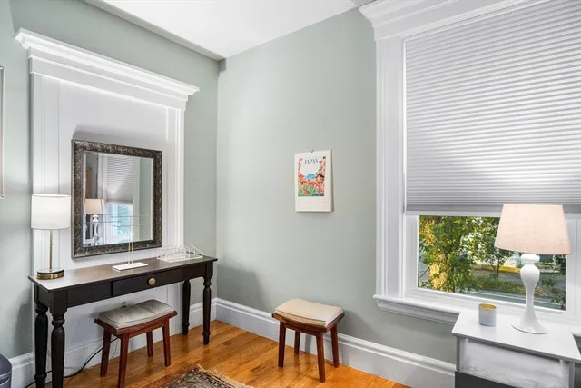 a living room with a table and a window