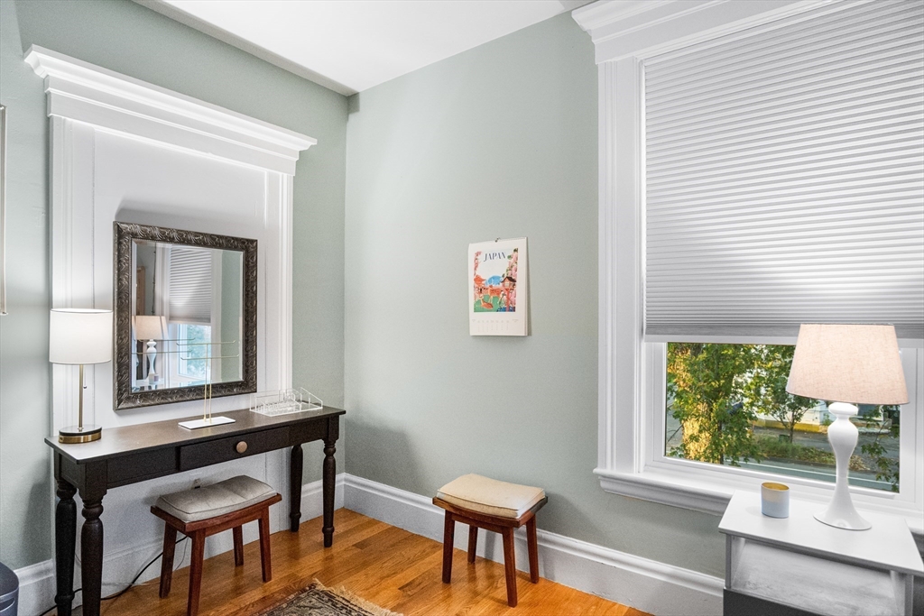 149 High Street, Unit 4 Danvers, MA 01923 - Photo 21 of 33 a living room with a table and a window