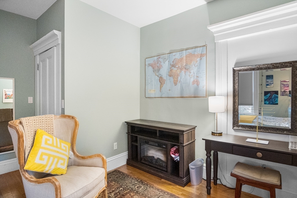 149 High Street, Unit 4 Danvers, MA 01923 - Photo 22 of 33 a living room with furniture and a fireplace