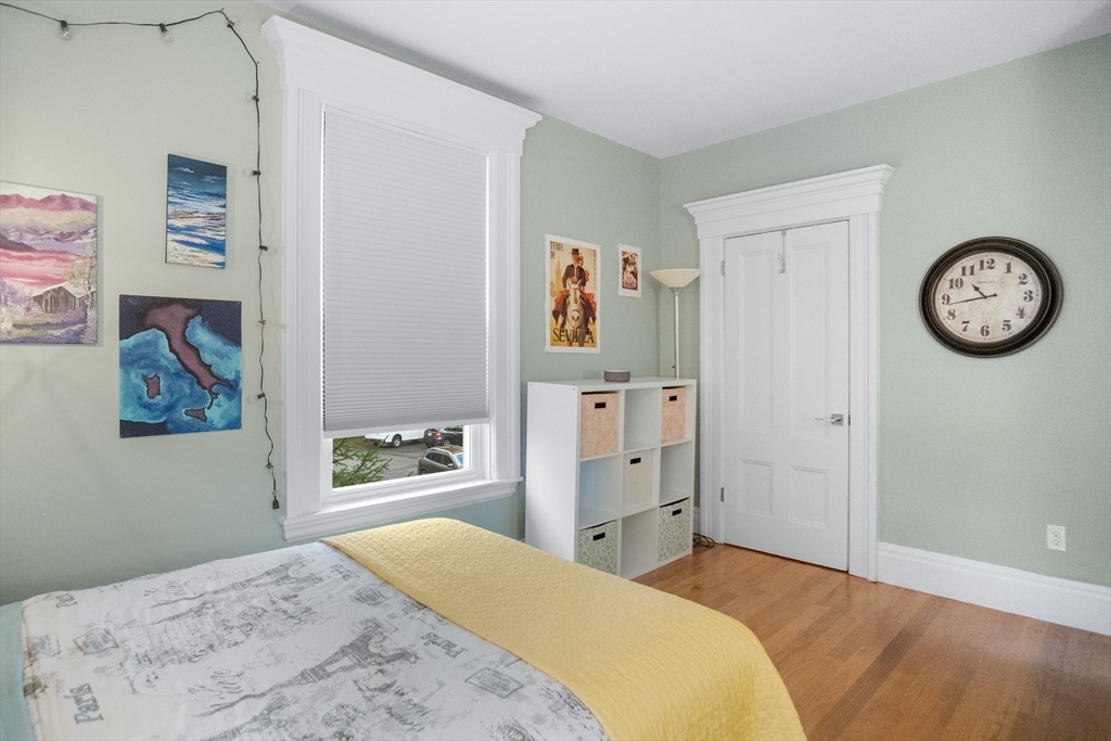 149 High Street, Unit 4 Danvers, MA 01923 - Photo 23 of 33 a bedroom with a bed and a closet