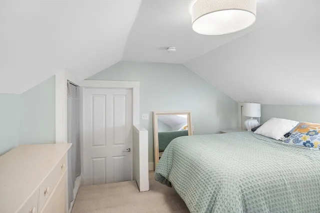 a bedroom with a bed and a cabinets