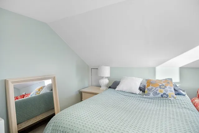 a bedroom with a bed and closet