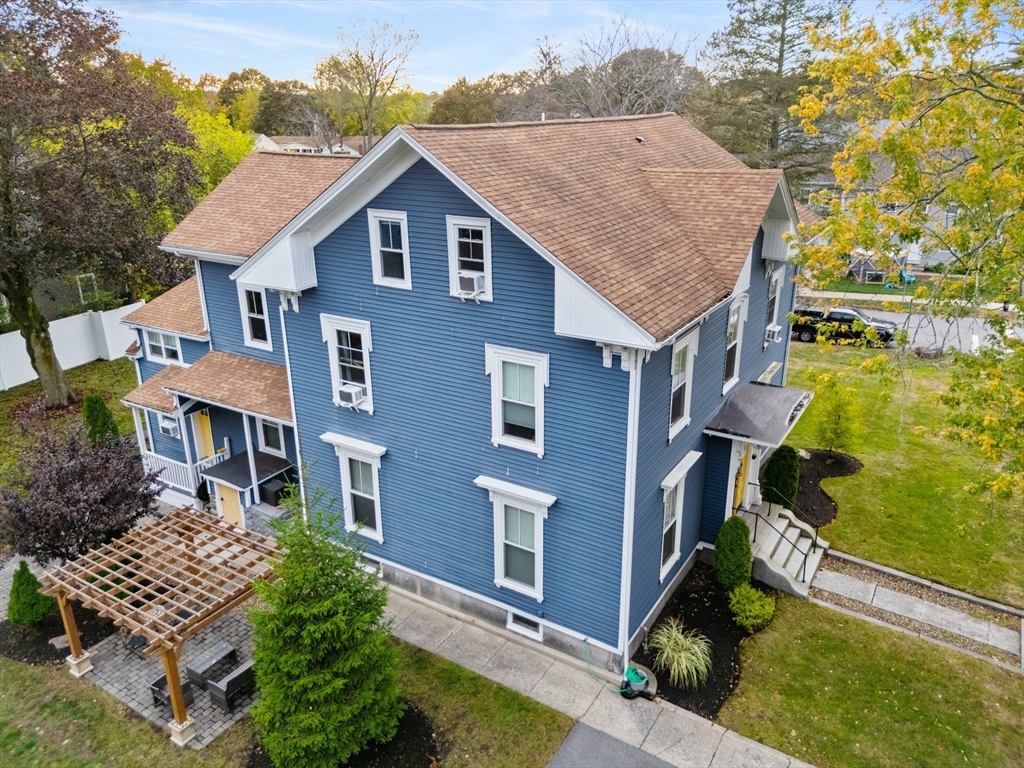 149 High Street, Unit 4 Danvers, MA 01923 - Photo 3 of 33 a aerial view of a house with a yard