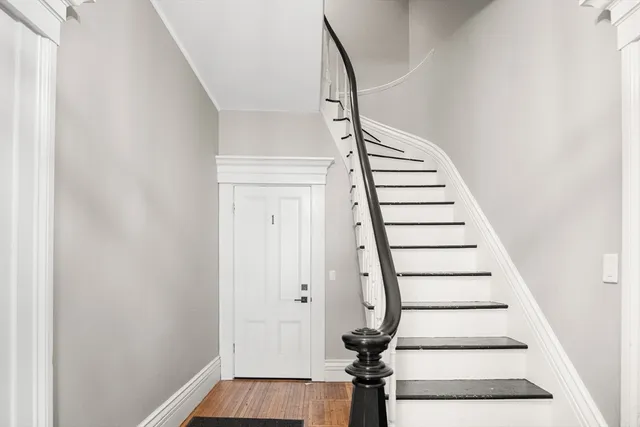 a view of entryway with wooden floor