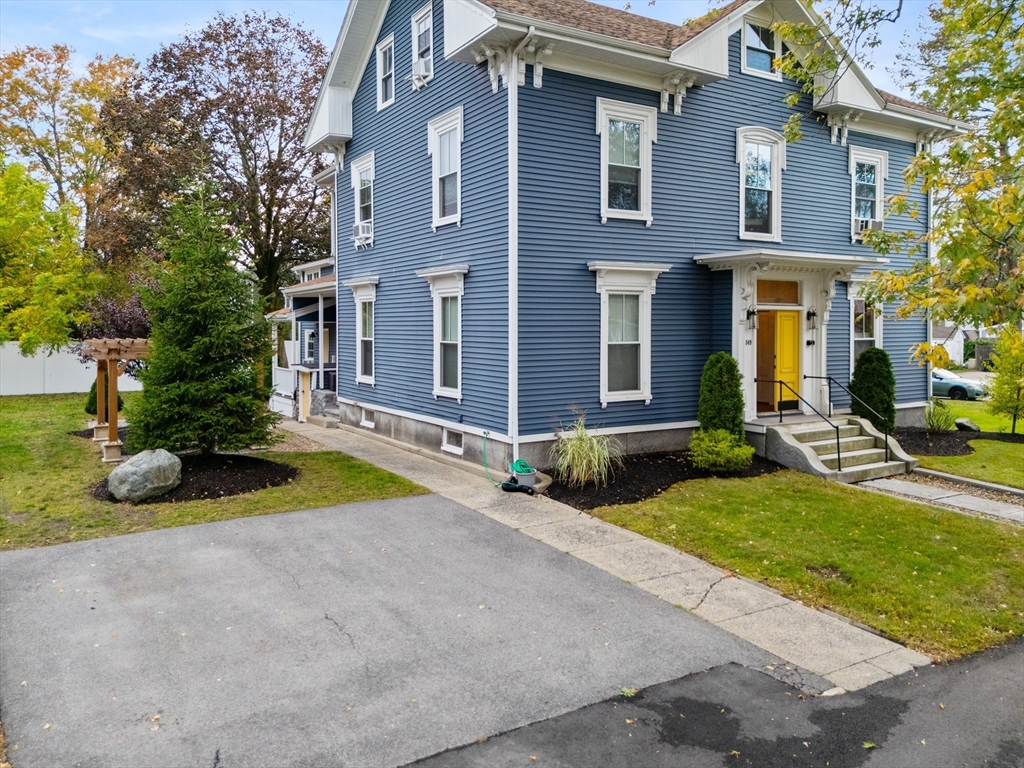 149 High Street, Unit 4 Danvers, MA 01923 - Photo 4 of 33 a view of brick house with a yard and large tree