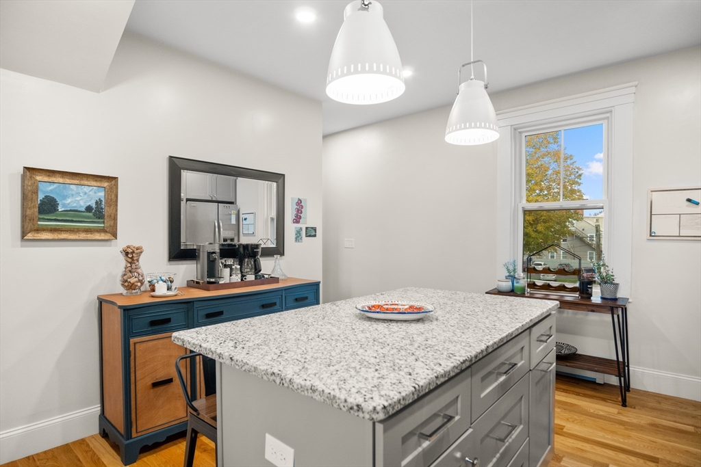 149 High Street, Unit 4 Danvers, MA 01923 - Photo 6 of 33 a kitchen with a table and chairs