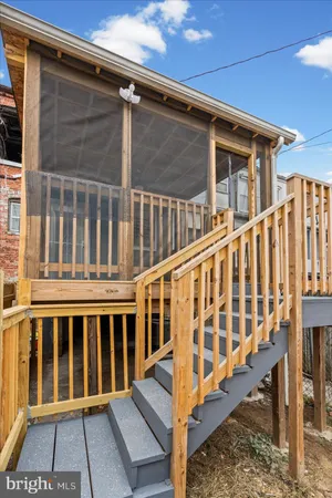 a view of porch with wooden floor