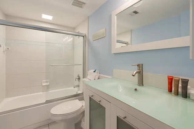 a bathroom with a sink a toilet and a bathtub