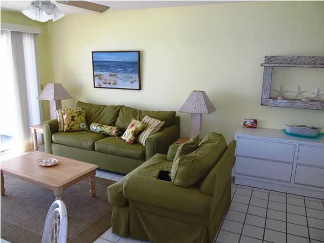 8294 Hwy Inlet Beach, Unit 9 30A Inlet Beach, FL 32461 - Photo 2 of 10 a living room with furniture and a lamp