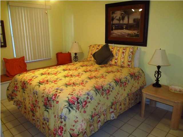 8294 Hwy Inlet Beach, Unit 9 30A Inlet Beach, FL 32461 - Photo 5 of 10 a bedroom with a bed and a window