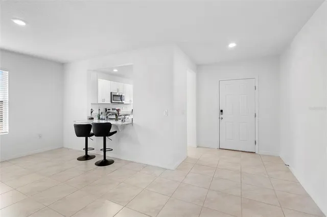 a kitchen with stainless steel appliances a refrigerator sink and cabinets