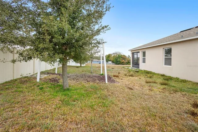 a backyard of a house with lots of green space